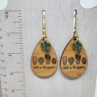 Cactus Charm and Laser Engraved "Not a Hugger" Earrings | 3.25" long | Gold Plated Stainless Steel Ear wires charm